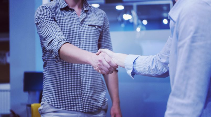 start up business people  handshake on team meeting  at modern business office interior